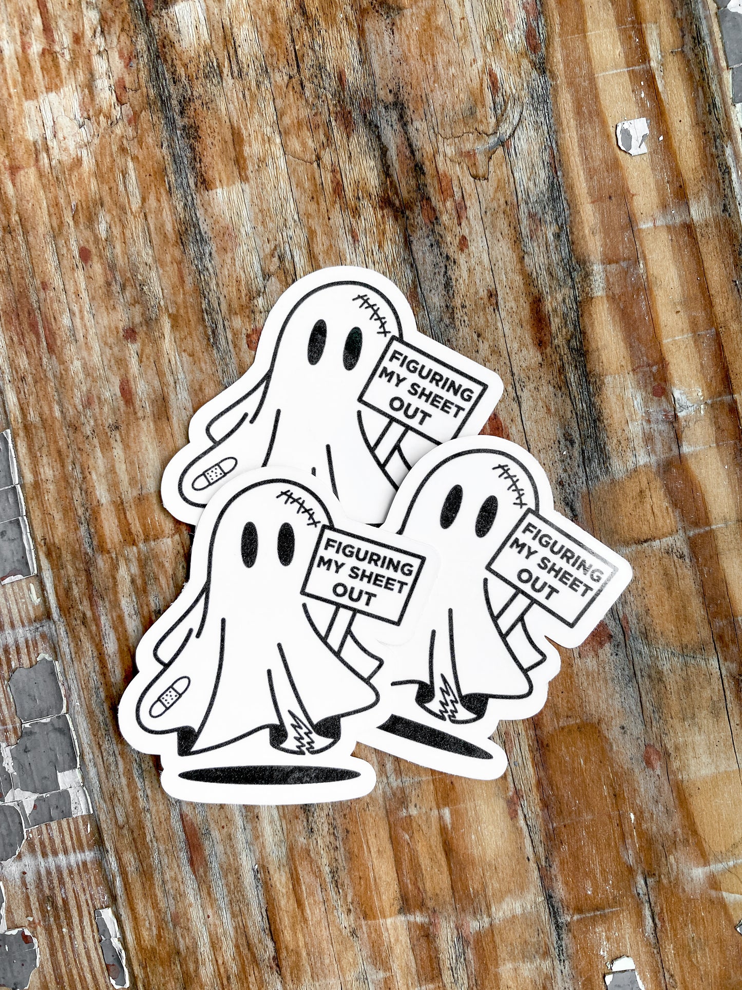 Collection of 3 spooky ghosts holding "figuring my sheet out" sign