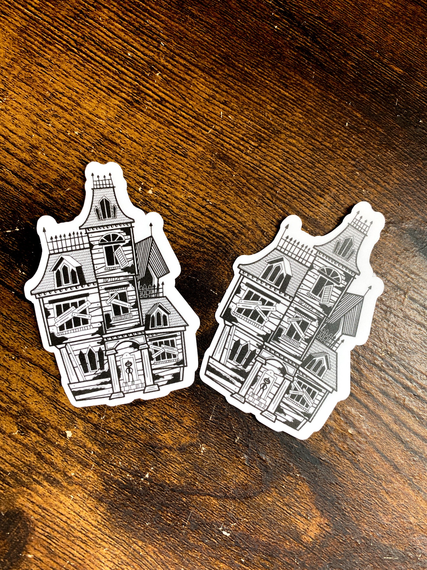2 haunted home stickers with line work and pattern. Pumpkin king standing in the doorway.